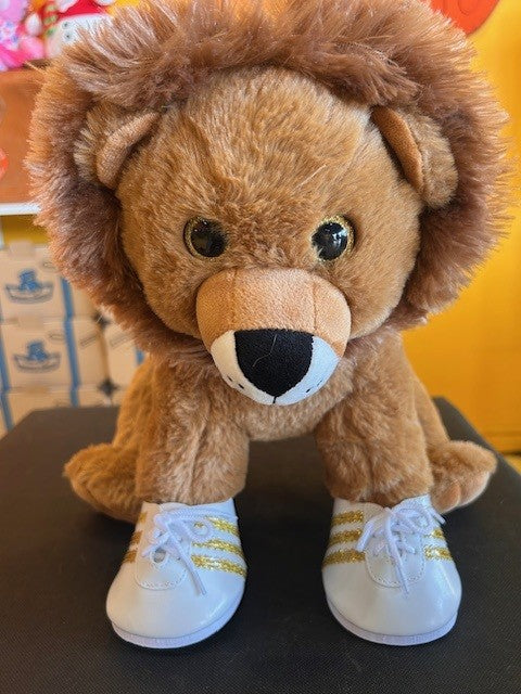 WHITE AND GOLD SPORTS SHOES