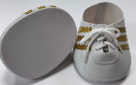 Zapatillas deportivas blancas y doradas